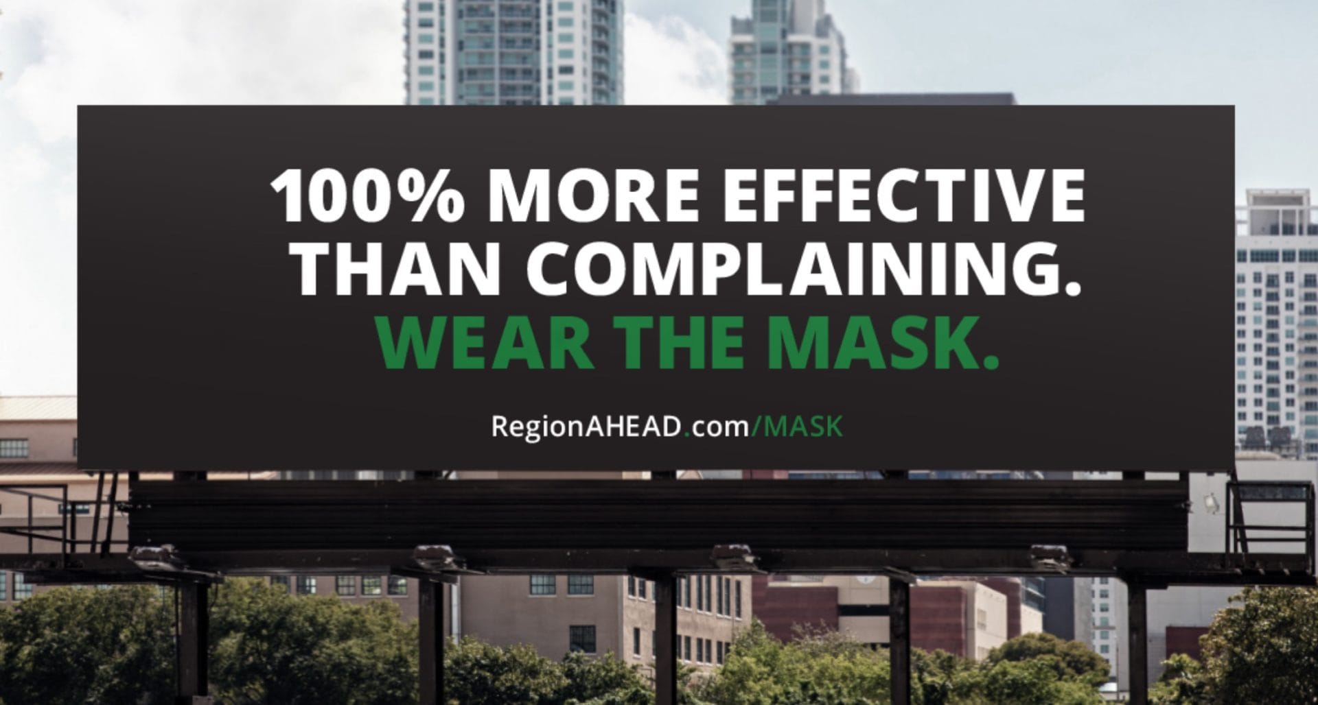 Wear the mask billboard stating that wearing a mask is 100% more effective than complaining.