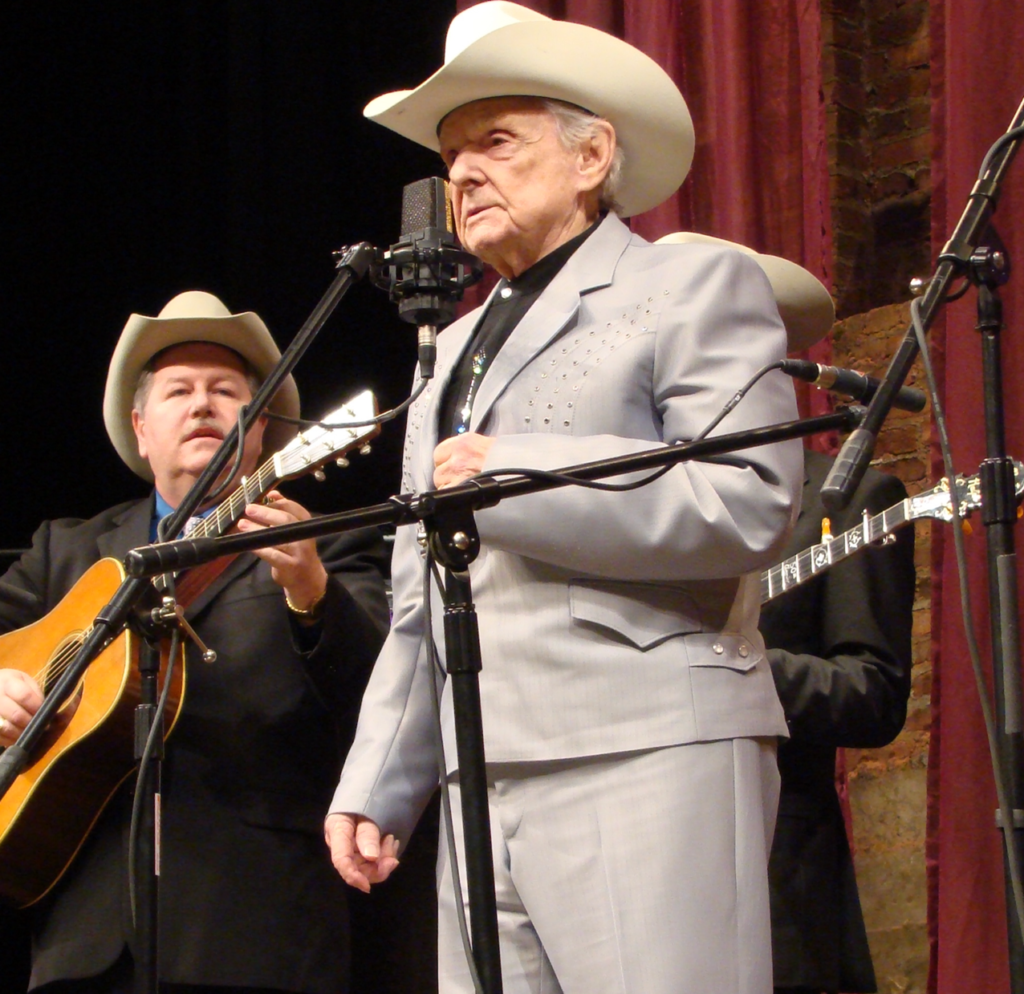 Dr. Ralph Stanley on stage with microphone