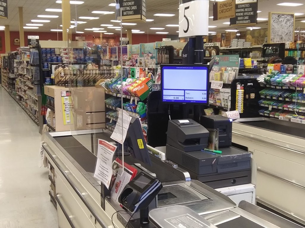 Image of the checkout counter in a grocery store.