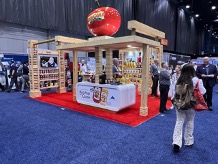 People walking around the Red Gold Foodserivce booth inside the 2024 National Restaurant Association show in Chicago