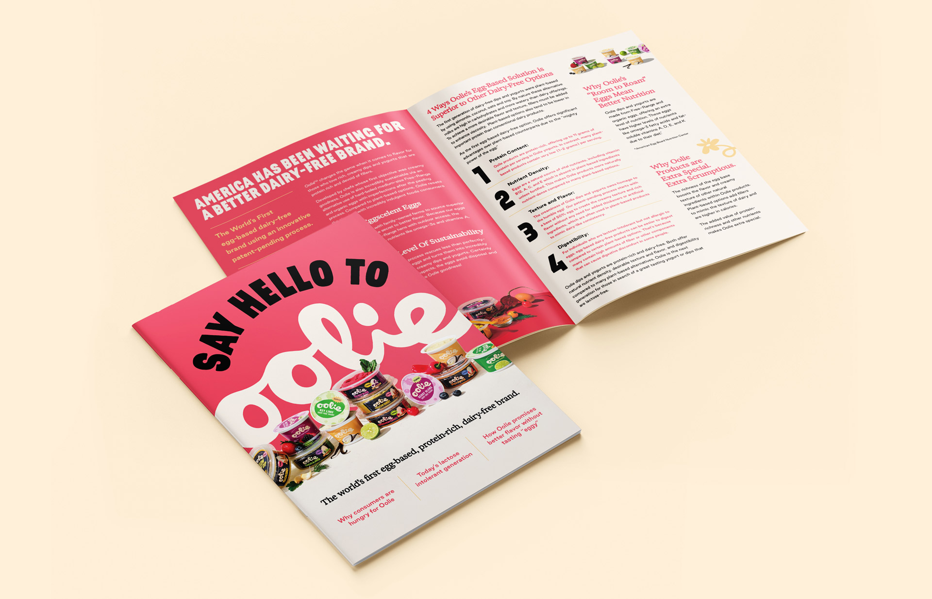 A printed Oolie brand brochure with a bold pink cover that says 