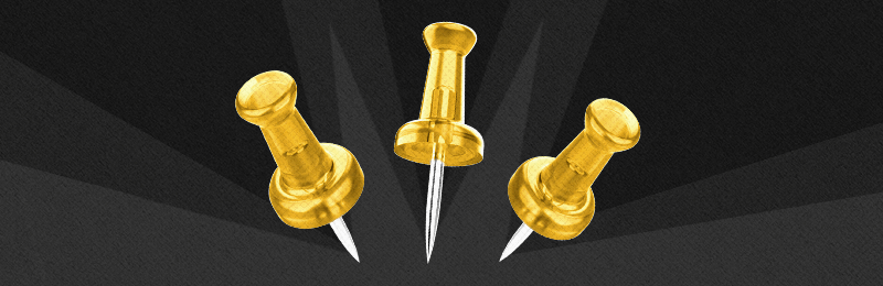 Gold thumbtacks on a gray burst